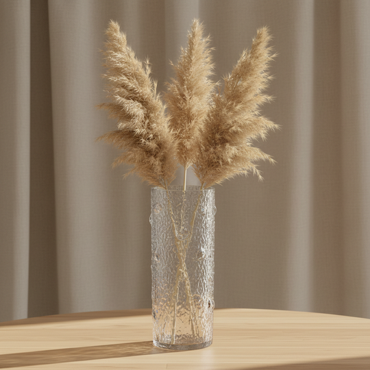 Textured glass bark vase styled with pampas grass on wooden surface