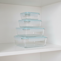 Borosilicate glass container set stacked on white shelf