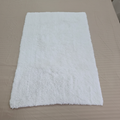 Luxe white shaggy bath mat with no tags, clean product shot