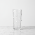 Textured glass bark vase on white marble with studio lighting