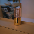 Hurricane glass vase with polished gold metal base, square format